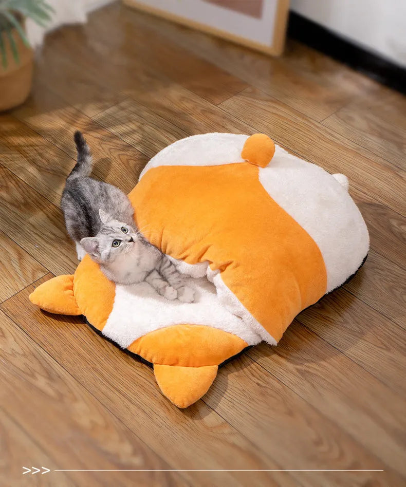 Orange semi-closed cat sleeping bag nest bed on a floor