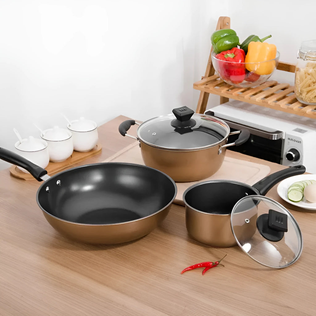 Three-piece cast iron cookware set with soup pot, milk pot and wok featuring non-stick coating