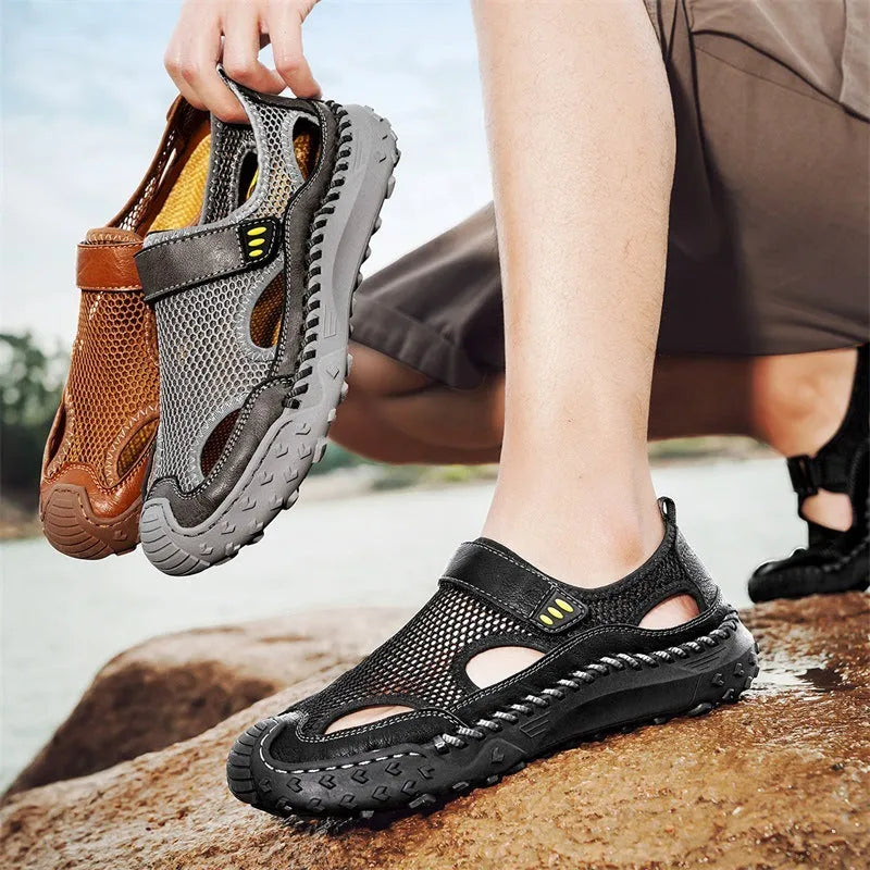 Men's black casual sandals showing breathable mesh upper and Velcro strap closure.
