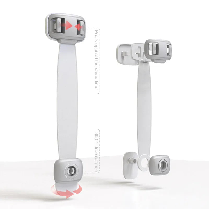 Grey and green adjustable child safety cabinet locks with adhesive backing on a kitchen drawer.