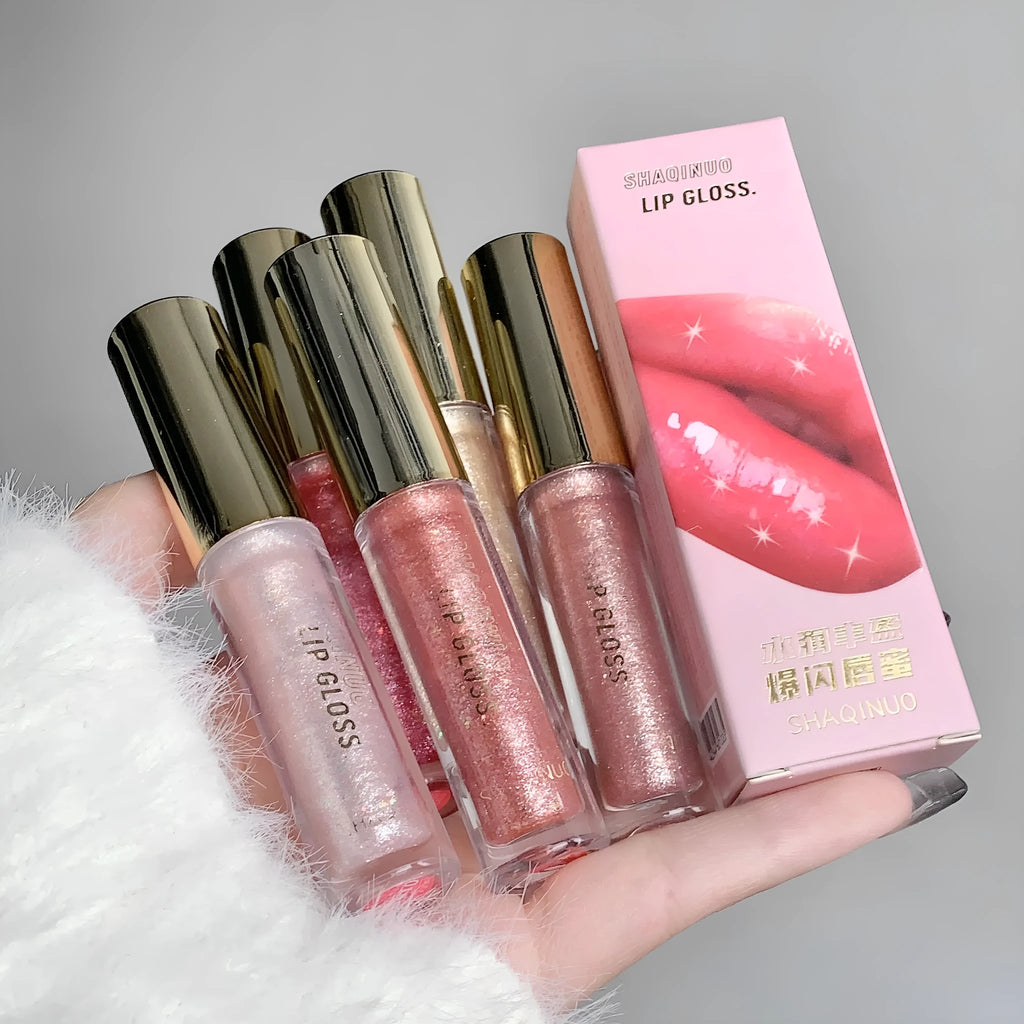 Moisturising flash lip gloss with mirror finish in five colours: cherry blossom pink, gilded flash, peach, purple, and berry red.