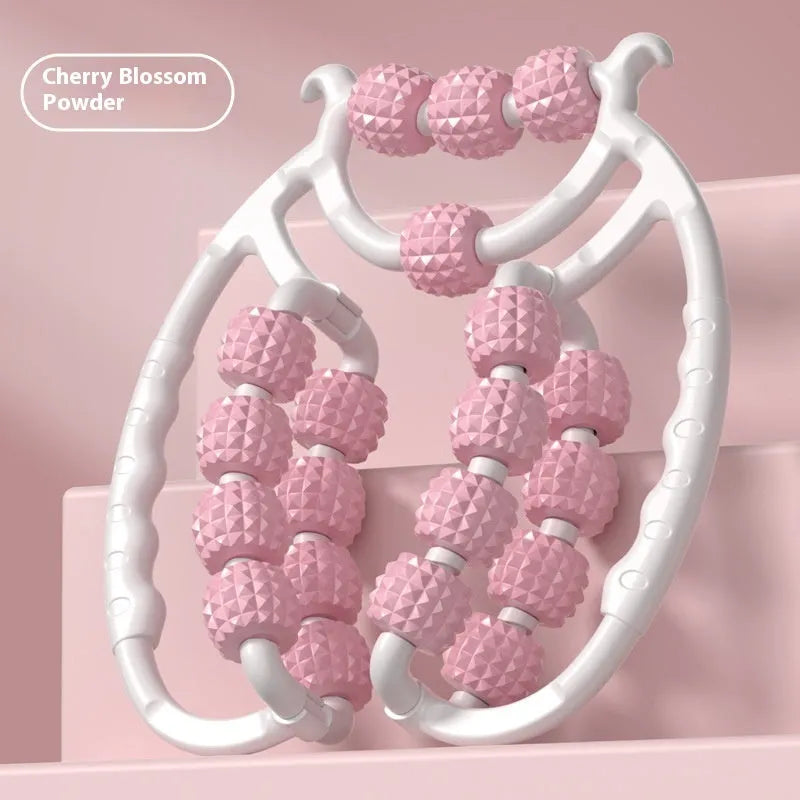 A handheld ring clip leg massage roller with double-row wheels, shown in coral pink.