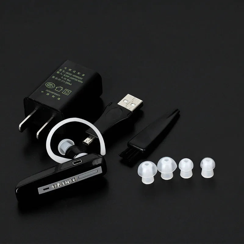 Black wireless invisible hearing aid with silicone shell and USB charging cable