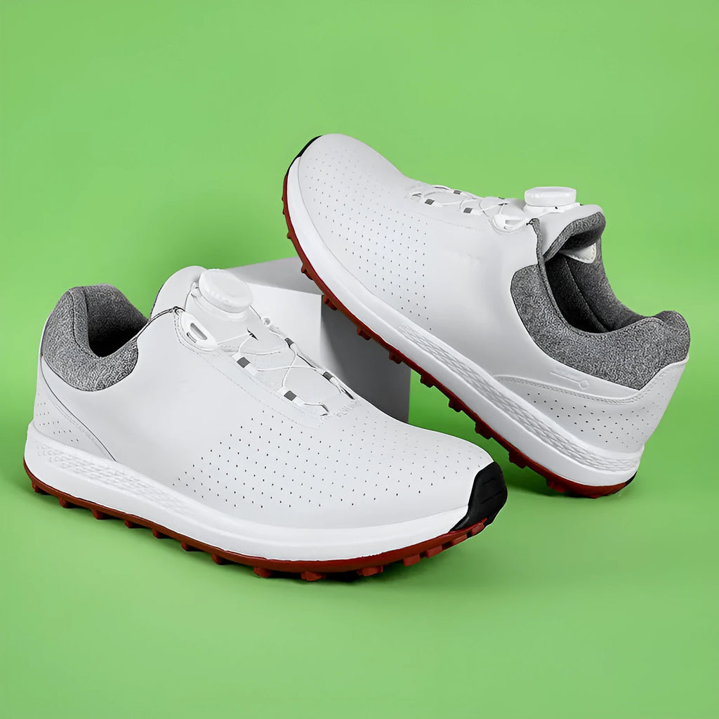 Men's white low-top casual golf shoe with breathable upper and textured non-slip sole.