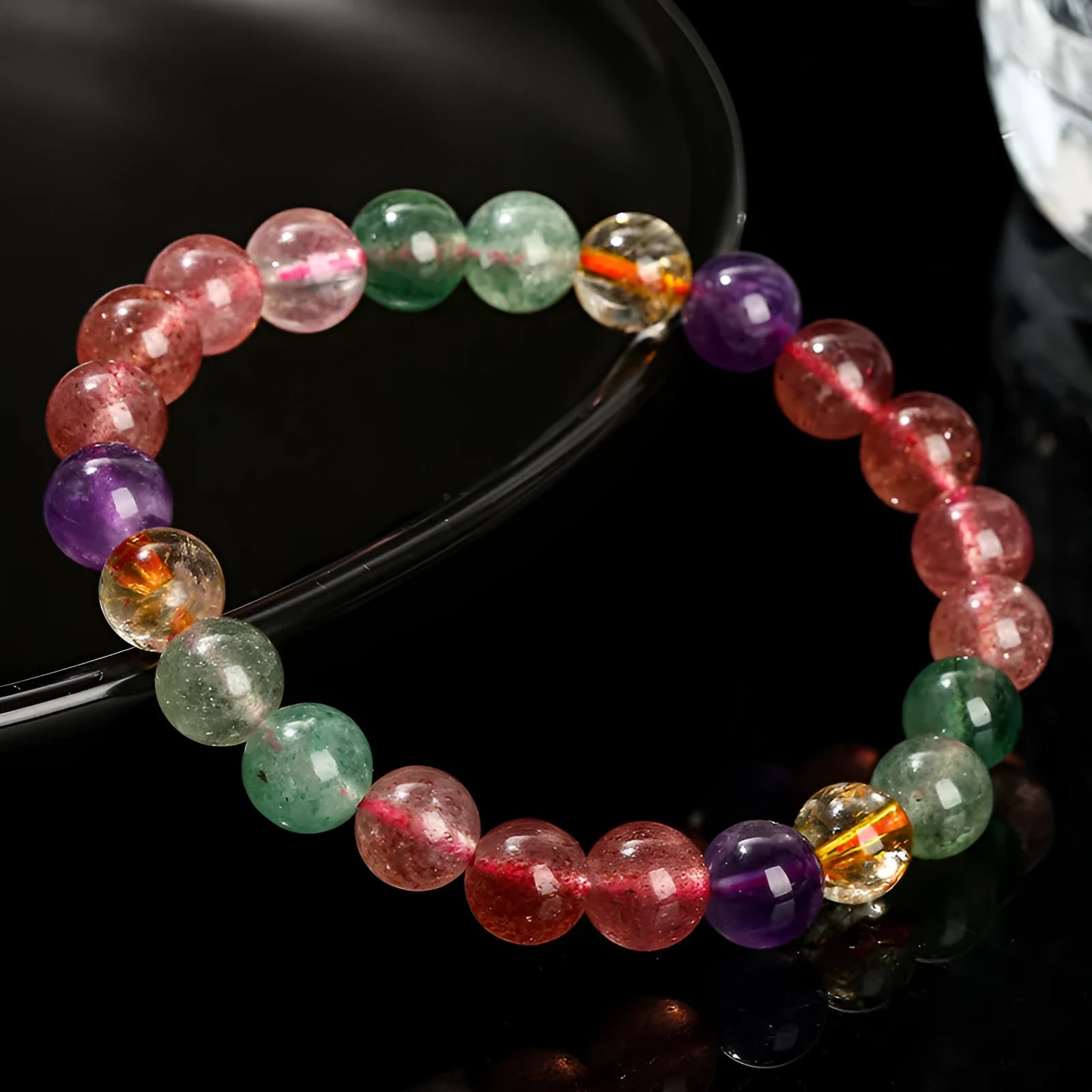Natural strawberry quartz gemstone bracelet with round geometric beads.