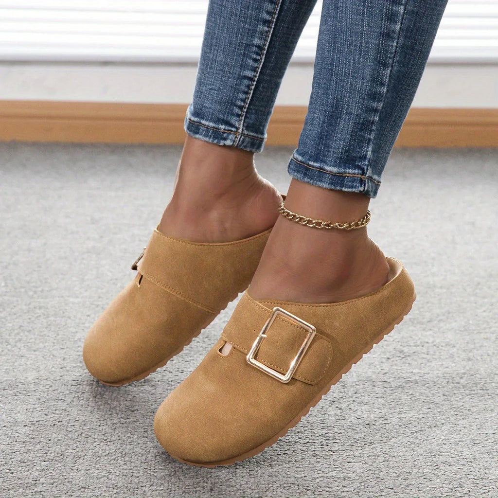 Women's closed toe canvas slipper in apricot colour showing low top design and elasticated heel.