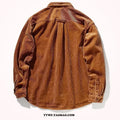 Caramel and grey loose fit long sleeve corduroy cardigan shirt on a hanger.