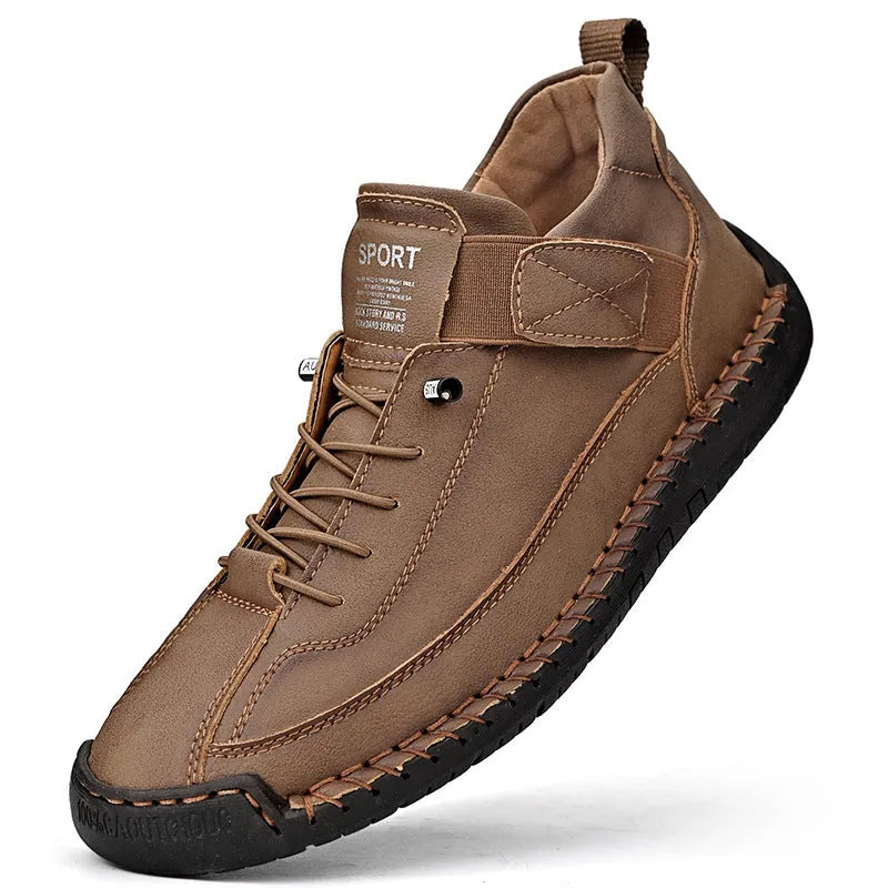 Men's mid-top Martin boots in black with tooling stitching detail and elastic band side entry