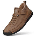 Men's mid-top Martin boots in black with tooling stitching detail and elastic band side entry
