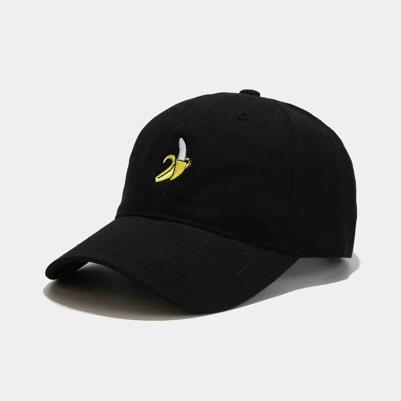 Adjustable banana-embroidered baseball cap in soft polyester fabric, shown in multiple colours.