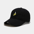 Adjustable banana-embroidered baseball cap in soft polyester fabric, shown in multiple colours.