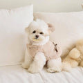 Light pink dog winter coat showing casual style and secure fastening