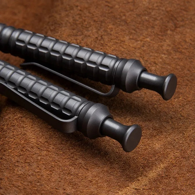 Gunmetal grey titanium tactical pen with push-action mechanism and 0.5mm nib