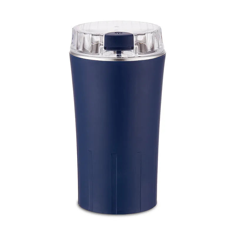Blue mini electric flour mill grinder with stainless steel construction on a kitchen countertop