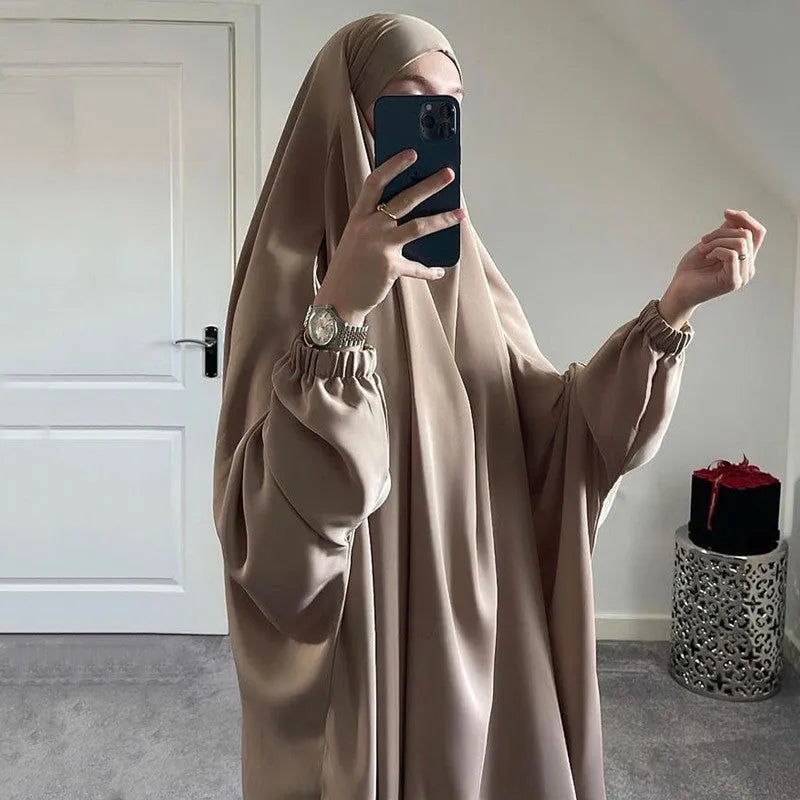 Women's one-piece prayer dress in dark green polyester with regular sleeves and strap details