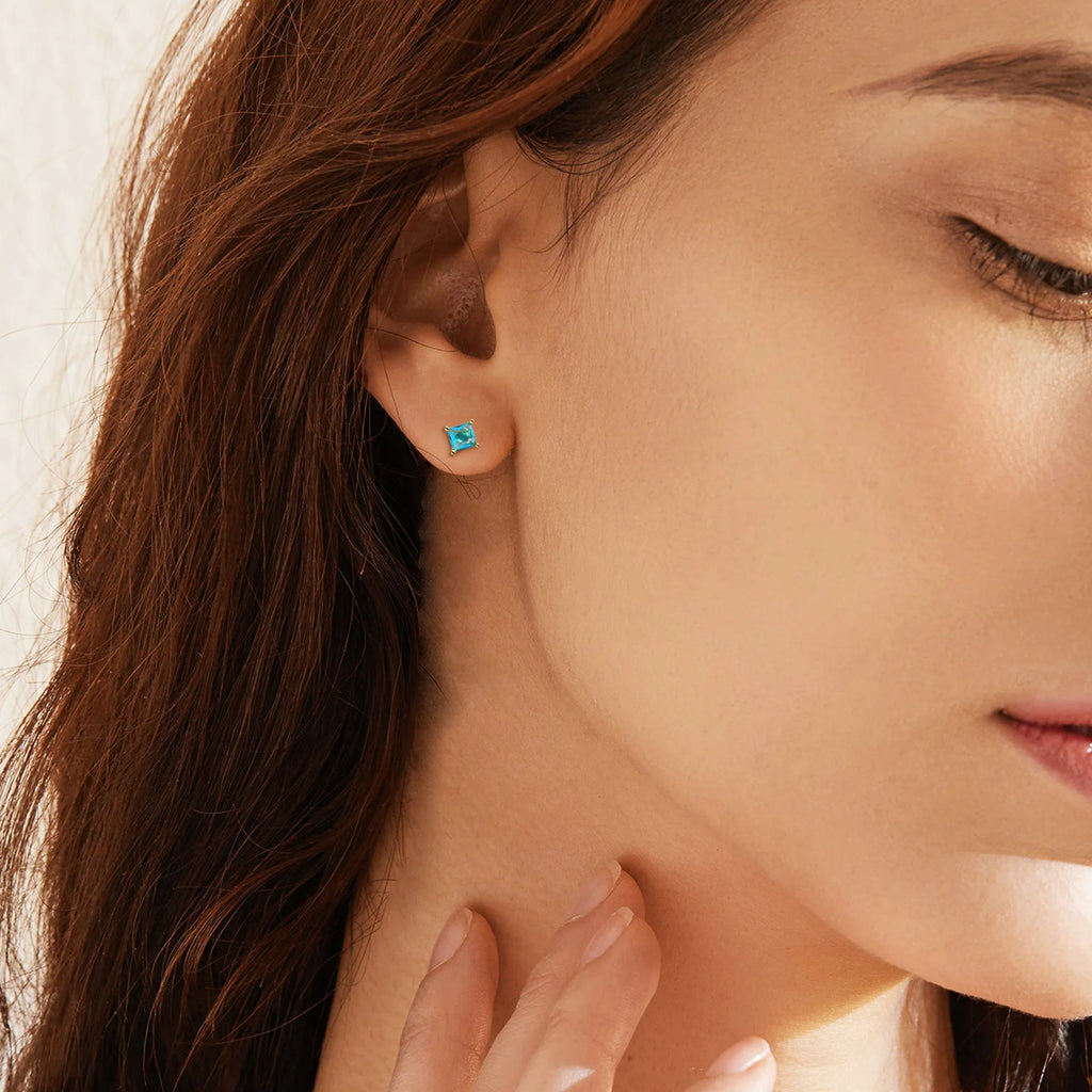 Gold-plated drop earrings with a pear-shaped candy-coloured zircon stone on a copper base.