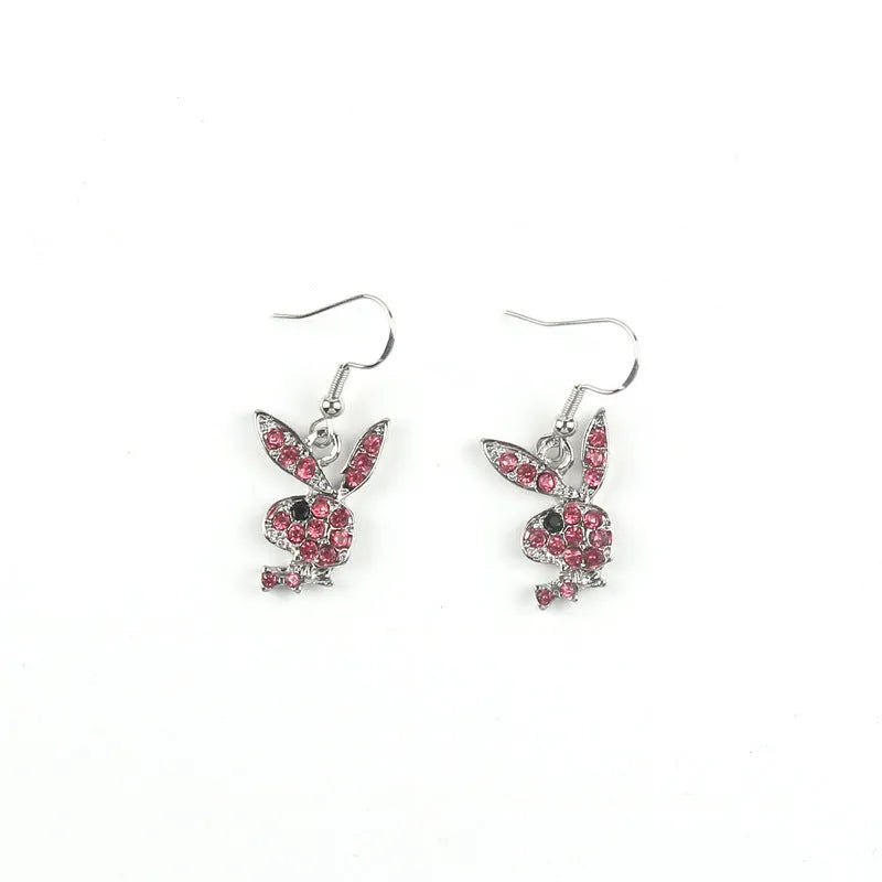 Close-up of rabbit-shaped alloy stud earrings in gold, pink, and silver colour options.