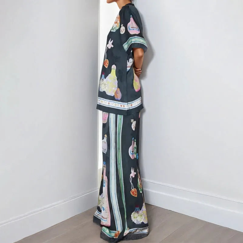 Black women's cardigan and trouser set with cartoon animation print