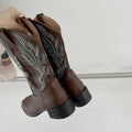 Brown women's embroidered mid-calf Martin boots with a low square heel and round toe.