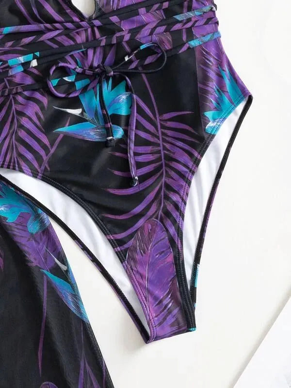 Women's polyester three-piece swimsuit bikini set with coat in a pattern design.