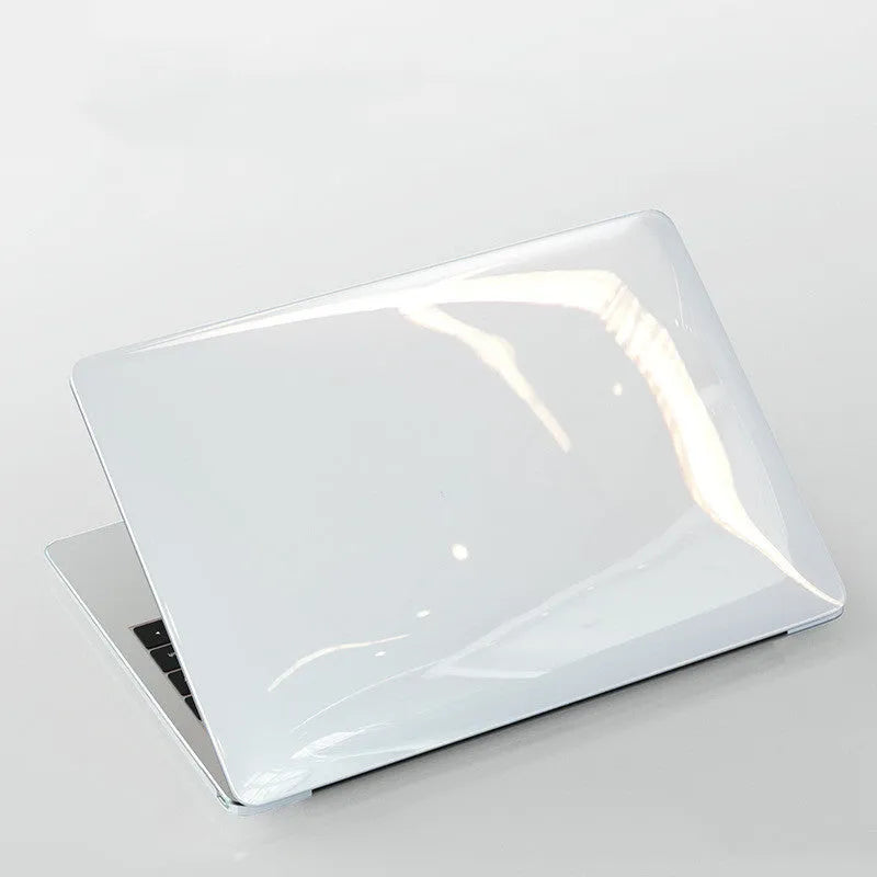 Black PC hard shell protective case fitted on a silver MacBook Pro laptop.