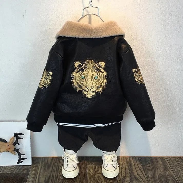 Black PU leather long-sleeved plus velvet jacket for boys with lapel collar and zipper closure, flat lay view
