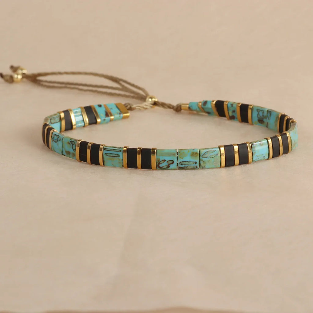 Geometric glass beaded bracelet in five colour options with pull beads adjustment