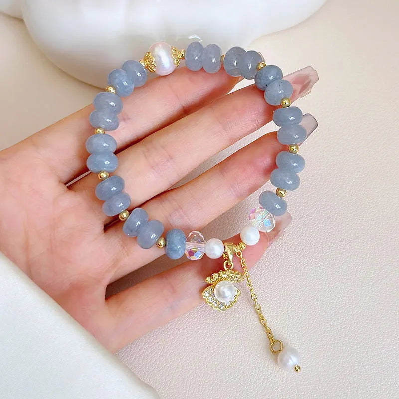 Natural aquamarine pearl and shell bracelet on adjustable stretch cord
