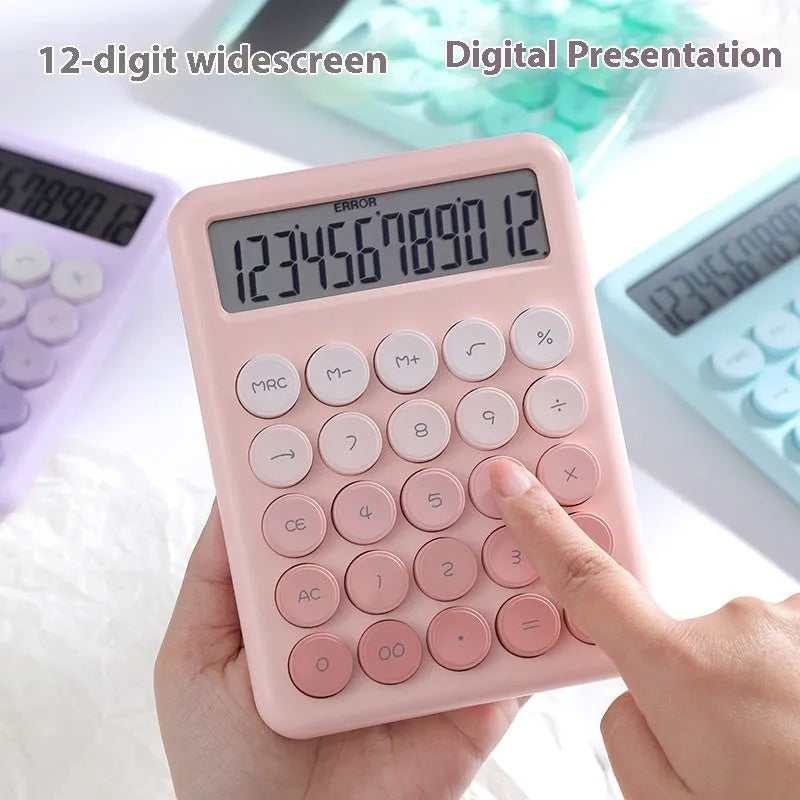 12-digit gradient colour desktop calculator in violet, blue, green, or pink on a desk