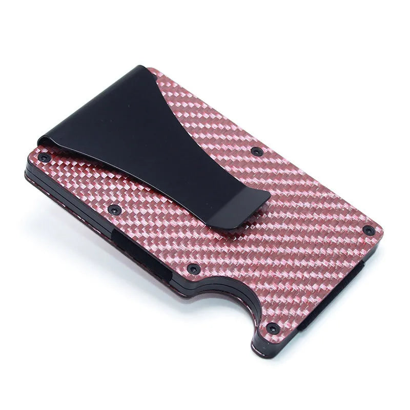 Slim black carbon fibre card holder wallet with geometric design on a gift box.