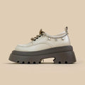 White platform Mary Jane shoes with chunky heel and front lace-up closure