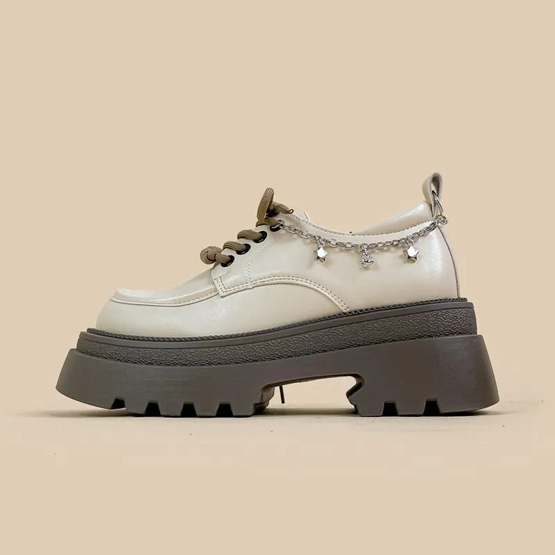 White platform Mary Jane shoes with chunky heel and front lace-up closure