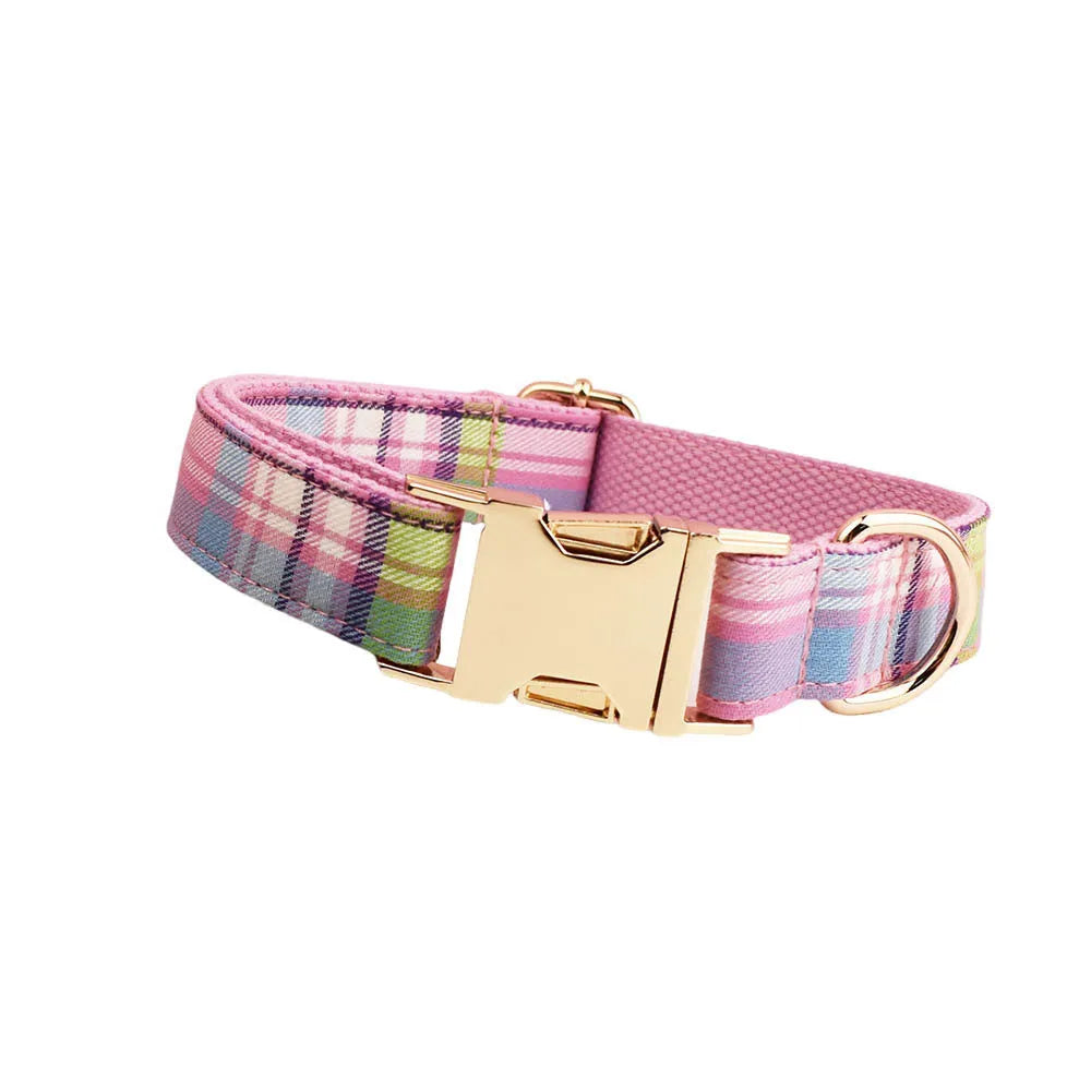 Four-piece cloth dog accessory set showing collar, leash, bow, and vest for small to large dogs.