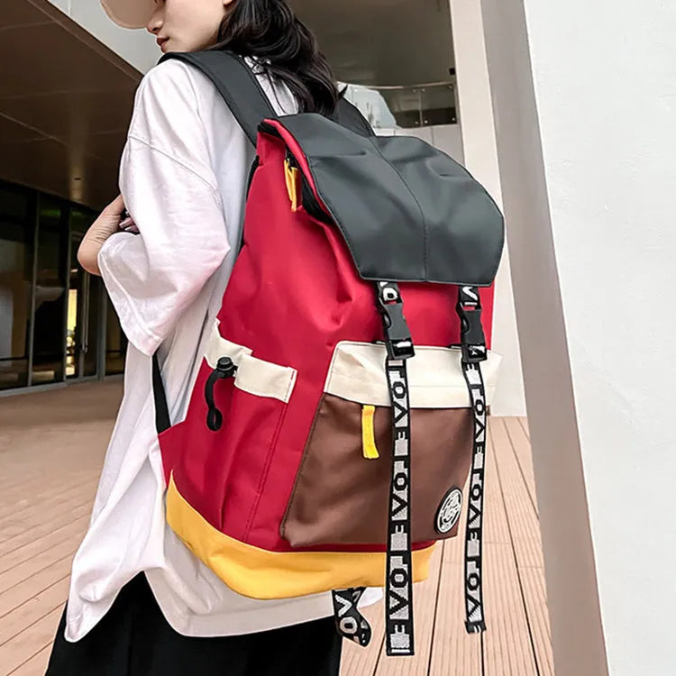 Oxford cloth student backpack in black, green, or red, showing handheld and shoulder straps.