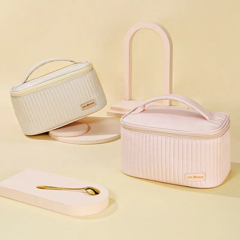 Open-top women's makeup bag in solid-colour PU leather, shown in beige.