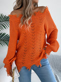 White hollow-out long-sleeved pullover sweater with an off-the-shoulder cut and regular sleeves on a hanger.