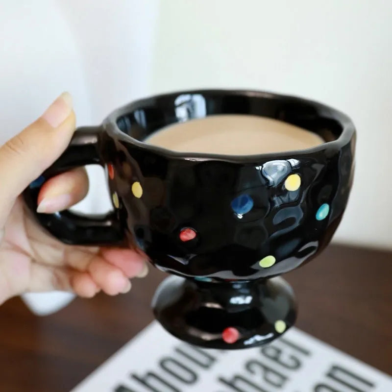 Hand-pinched irregular ceramic mug in solid colour with modern simple design