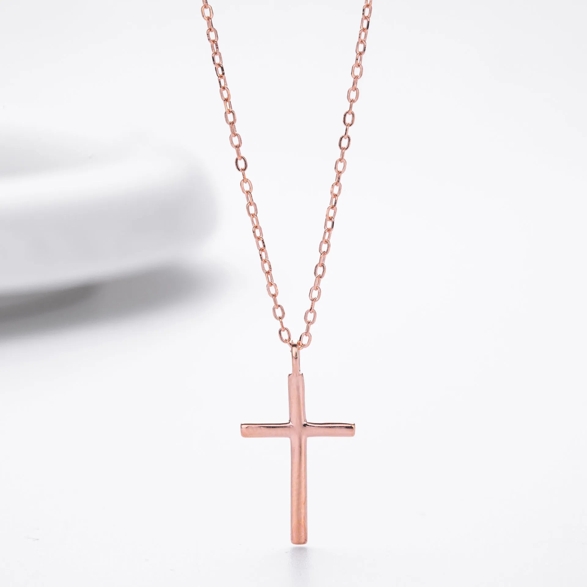 Sterling silver necklace with simple cross pendant on O-shaped chain in gold, platinum, or rose gold finish