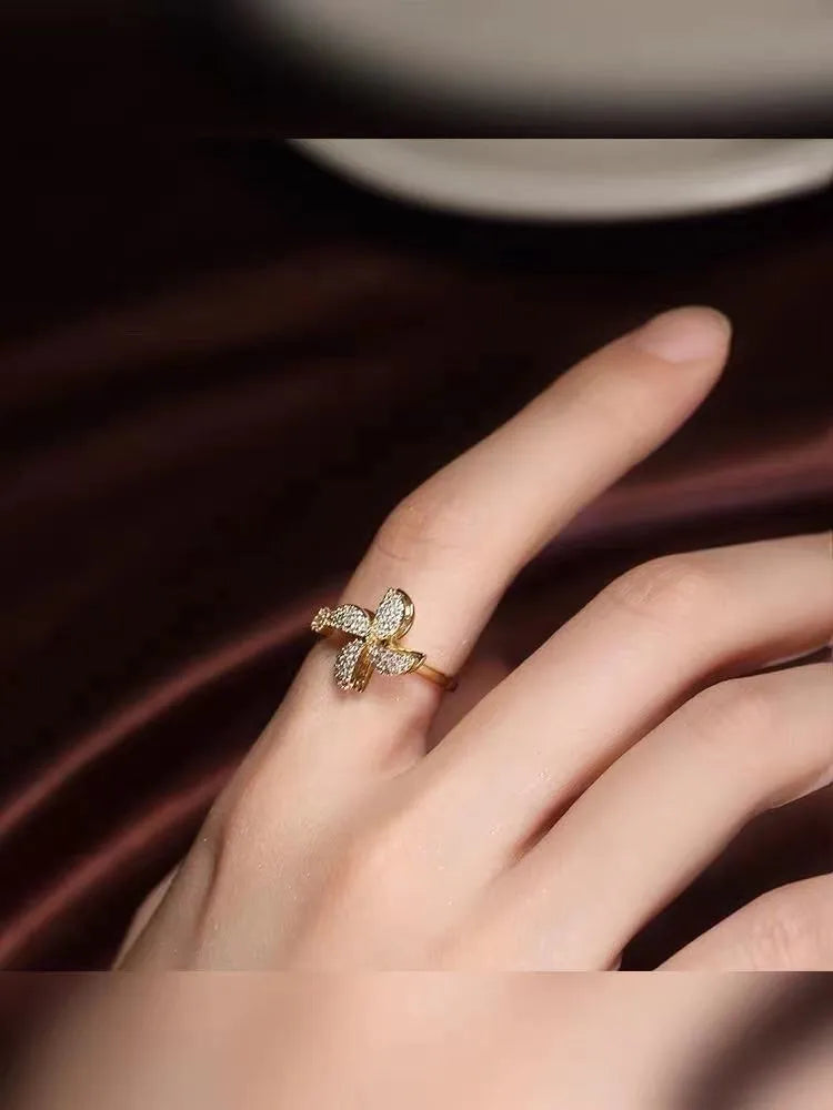 Rotating micro inlaid windmill ring in gold or silver electroplated finish