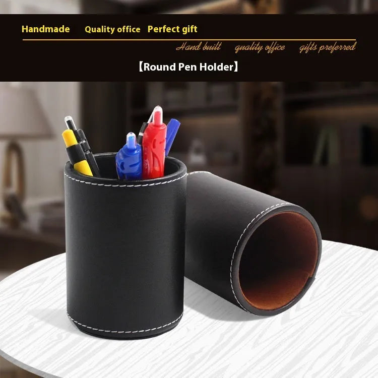 Small round black leather pen holder container showing cylindrical shape and compact dimensions