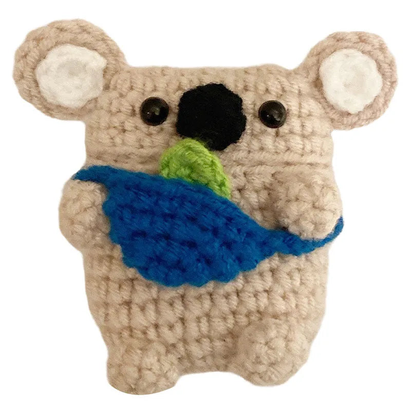 Handmade knitted grey koala bear backpack design cover on an Apple AirPods Pro charging case.