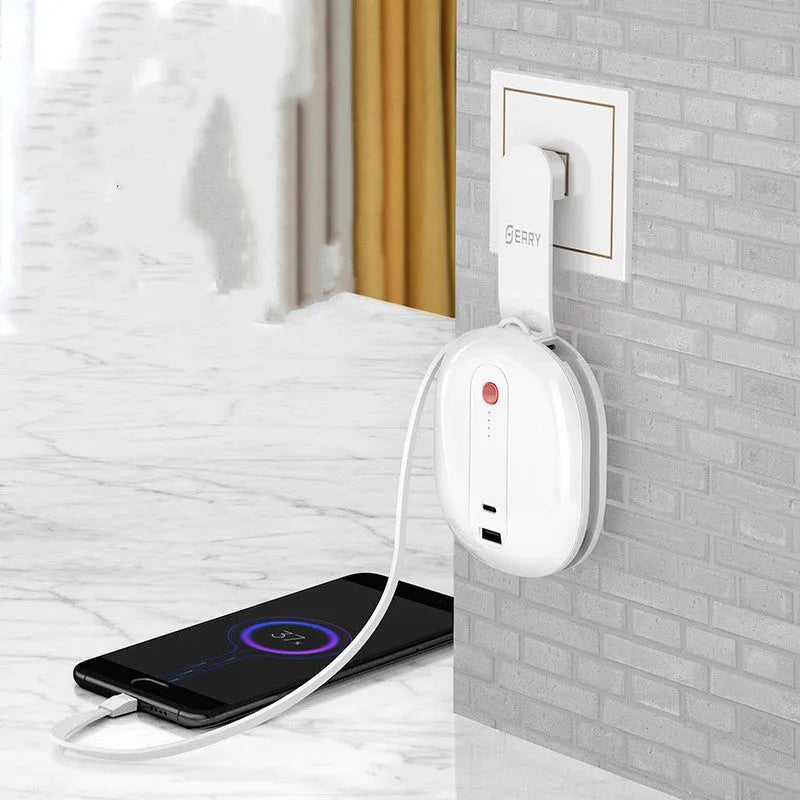 White and black two-in-one power bank with integrated plug showing 10000mAh capacity and compact size