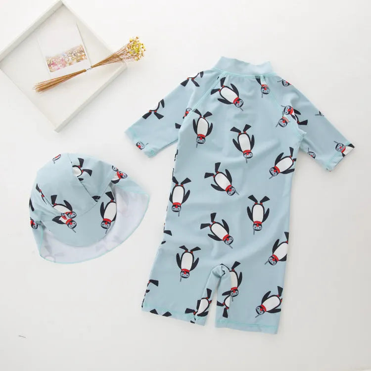 Boy's penguin print long sleeve swimsuit one-piece with matching swim cap for sun protection