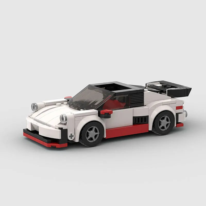 Small particle plastic building blocks model of a cool convertible sports car on a table