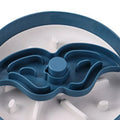 Grey rotating pet bowl with a windmill-pattern silicone licking mat insert for slow feeding.