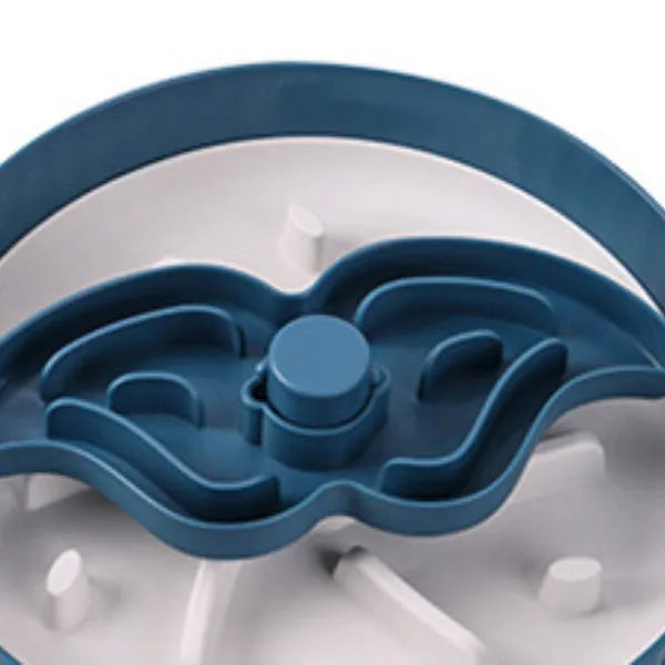 Grey rotating pet bowl with a windmill-pattern silicone licking mat insert for slow feeding.