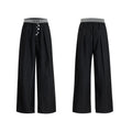 A pair of high-waisted straight-leg casual trousers in grey with a button fly front.