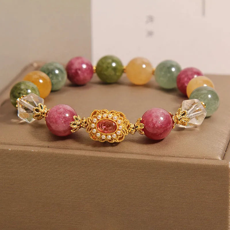 Close-up of a jade colour tourmaline bead bracelet on a pearl crystal base with alloy setting and rhinestones.