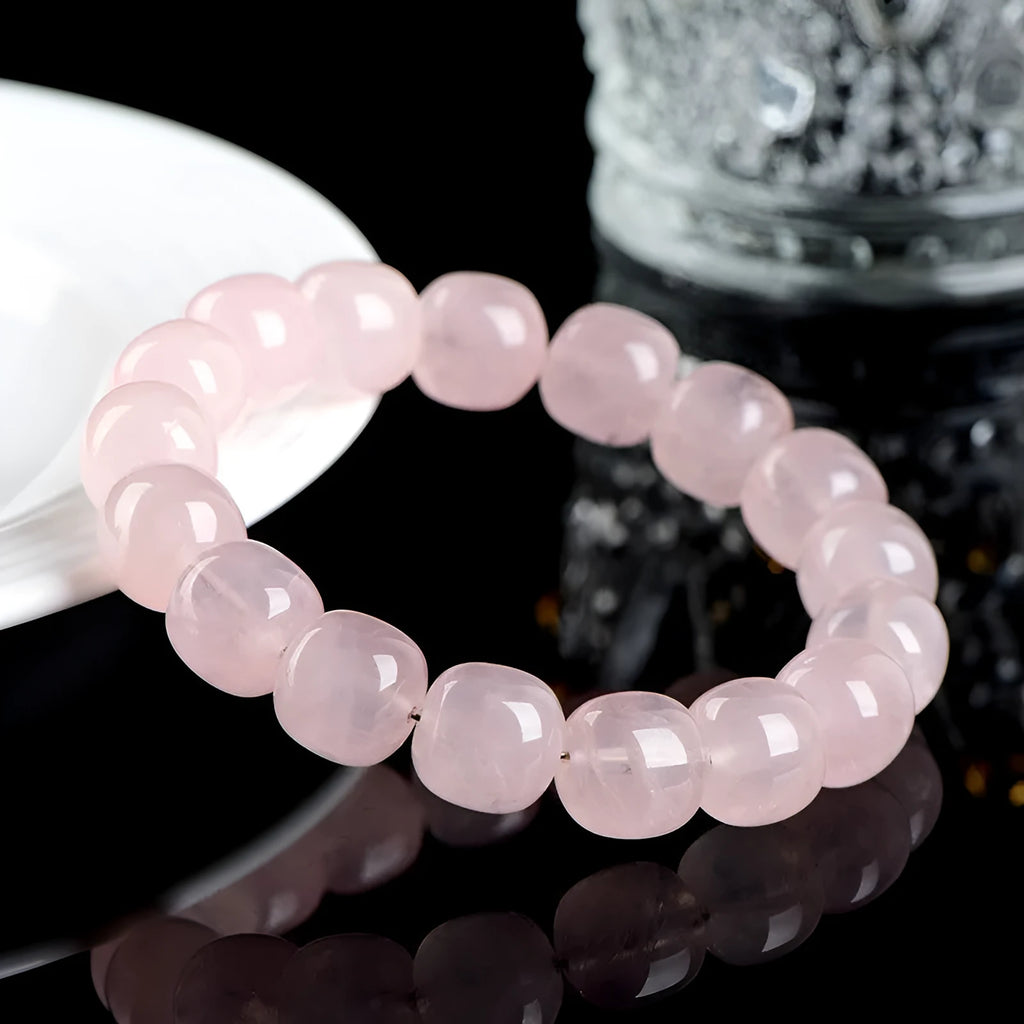 Pink bamboo and crystal barrel bead bracelet with geometric design measuring 11mm to 12mm