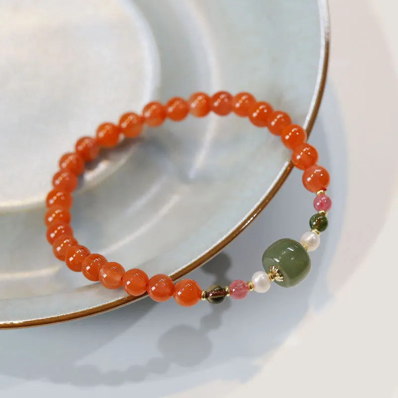 A round bead bracelet made from natural cherry red South Red Agate with a retro ethnic style.
